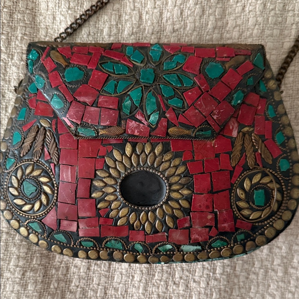 This item is a handmade metal mosaic clutch bag, an ethnic and bohemian-style